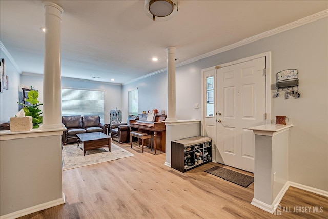 7 Cambridge Ct, East Brunswick, NJ 08816 - entryway featuring ornate columns, light wood-type flooring, crown molding, and recessed lighting
