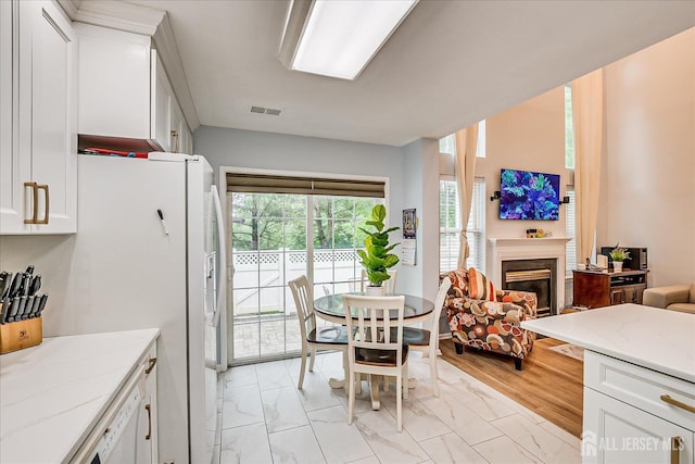 7 Cambridge Ct, East Brunswick, NJ 08816 - dining area with light marble finish floors and a fireplace