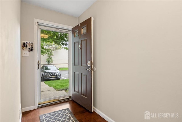 11 Excalibur Ct, Old Bridge, NJ 08857 - entrance foyer with baseboards and dark wood-style floors