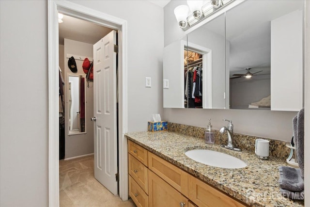 11 Excalibur Ct, Old Bridge, NJ 08857 - bathroom featuring vanity, a ceiling fan, and a walk in closet
