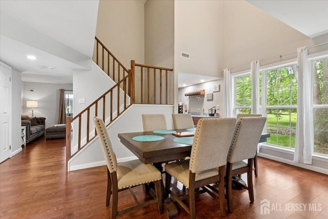 11 Excalibur Ct, Old Bridge, NJ 08857 - dining room featuring stairway, a towering ceiling, wood finished floors, and recessed lighting