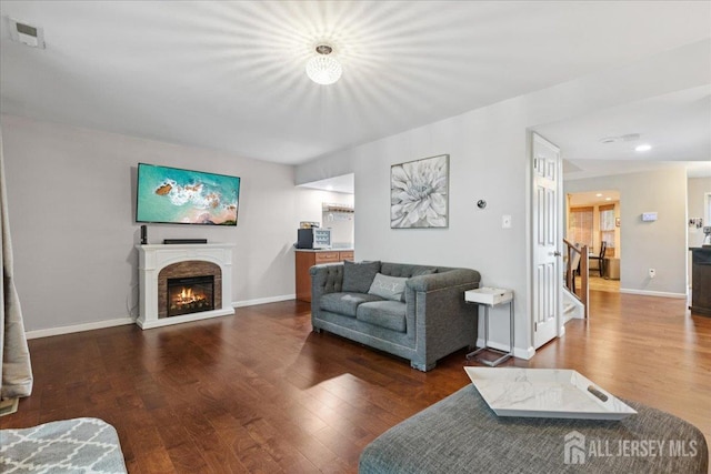 11 Excalibur Ct, Old Bridge, NJ 08857 - living room with wood finished floors, a glass covered fireplace, and stairway