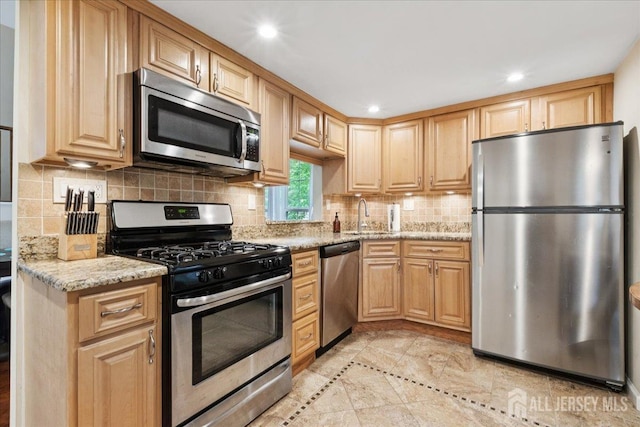 11 Excalibur Ct, Old Bridge, NJ 08857 - kitchen with appliances with stainless steel finishes, light stone countertops, recessed lighting, backsplash, and light brown cabinetry