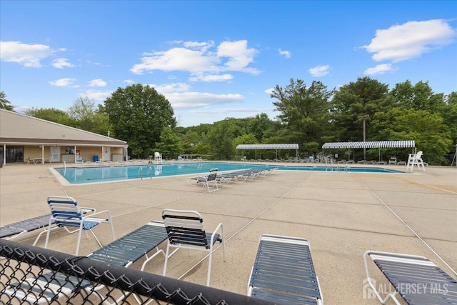 11 Excalibur Ct, Old Bridge, NJ 08857 - community pool featuring a patio area