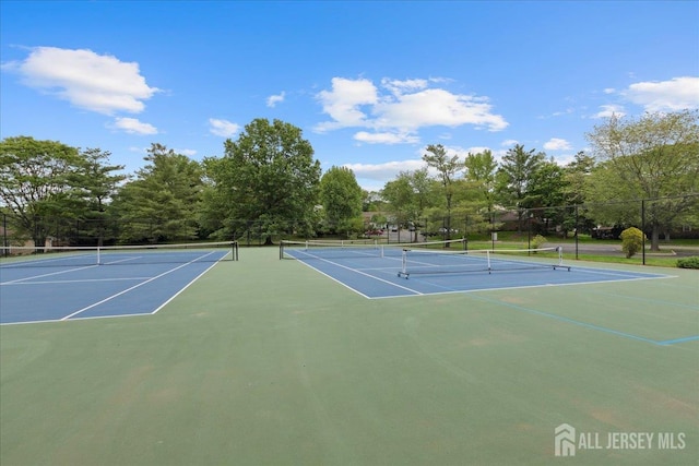 11 Excalibur Ct, Old Bridge, NJ 08857 - view of tennis court with community basketball court and view of scattered trees