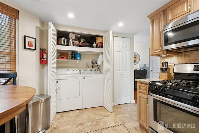 11 Excalibur Ct, Old Bridge, NJ 08857 - kitchen with stainless steel appliances, washing machine and dryer, backsplash, light countertops, and recessed lighting