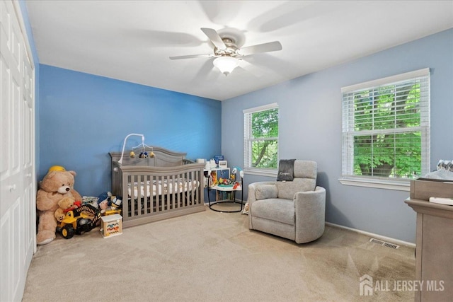 11 Excalibur Ct, Old Bridge, NJ 08857 - carpeted bedroom with ceiling fan and a crib