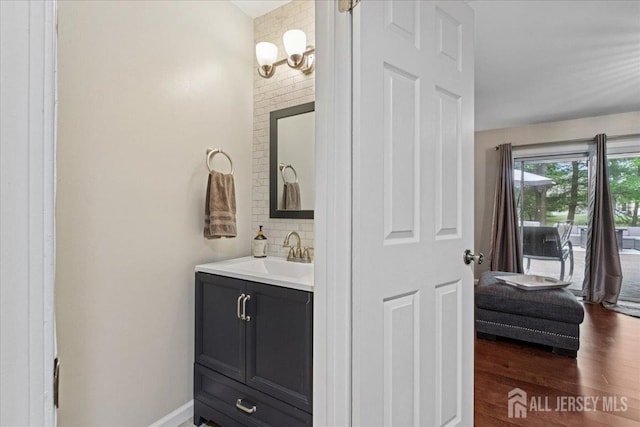 11 Excalibur Ct, Old Bridge, NJ 08857 - bathroom featuring vanity, tasteful backsplash, and wood finished floors