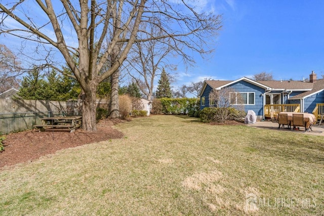 view of yard with fence and a patio area