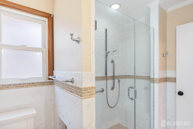 137 Safran Ave, Edison, NJ 08837 - full bath with ornamental molding, tile walls, a shower stall, and a wainscoted wall