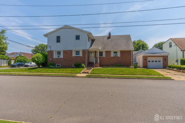 137 Safran Ave, Edison, NJ 08837 - view of front of home with brick siding, a front yard, and concrete driveway