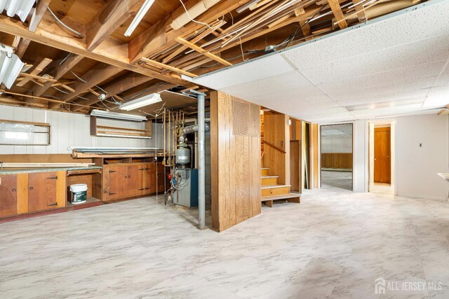 137 Safran Ave, Edison, NJ 08837 - below grade area featuring stairs, a heating unit, and wooden walls