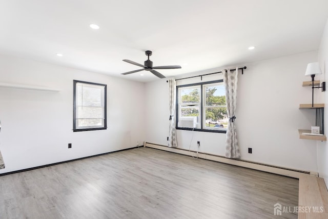 137 Safran Ave, Edison, NJ 08837 - empty room featuring a baseboard heating unit, wood finished floors, a ceiling fan, and recessed lighting
