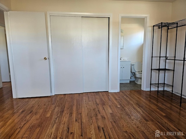 2 Brookside Rd, Edison, NJ 08817 - unfurnished bedroom featuring a closet, wood finished floors, a sink, and ensuite bathroom