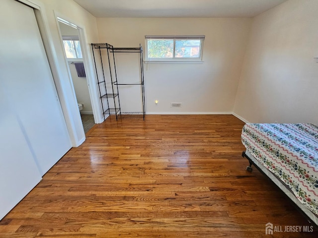 2 Brookside Rd, Edison, NJ 08817 - unfurnished bedroom with wood finished floors and baseboards
