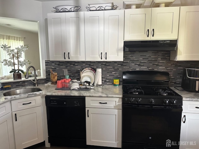 1202 Harbor Club Dr, Sayreville, NJ 08859 - kitchen with white cabinetry, tasteful backsplash, under cabinet range hood, a sink, and black appliances