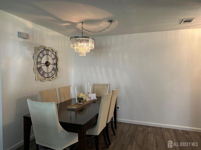 1202 Harbor Club Dr, Sayreville, NJ 08859 - dining space with wood finished floors, a notable chandelier, baseboards, and visible vents