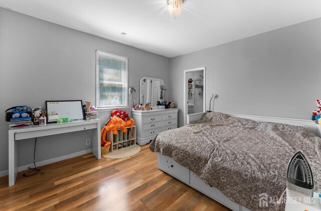 40 Highland St, East Brunswick, NJ 08816 - bedroom with wood finished floors and baseboards
