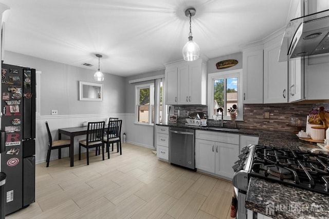 40 Highland St, East Brunswick, NJ 08816 - kitchen with dishwasher, range hood, freestanding refrigerator, and plenty of natural light
