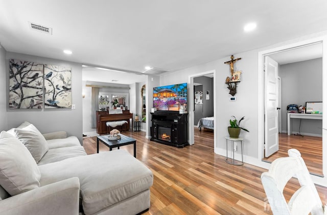 40 Highland St, East Brunswick, NJ 08816 - living area featuring light wood-style flooring, recessed lighting, and a glass covered fireplace