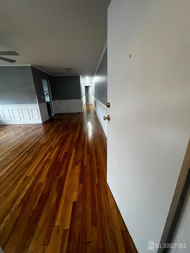 55 Gills Ln Unit 64, Iselin, NJ 08830 - corridor with ornamental molding, a wainscoted wall, dark wood-style floors, and a decorative wall