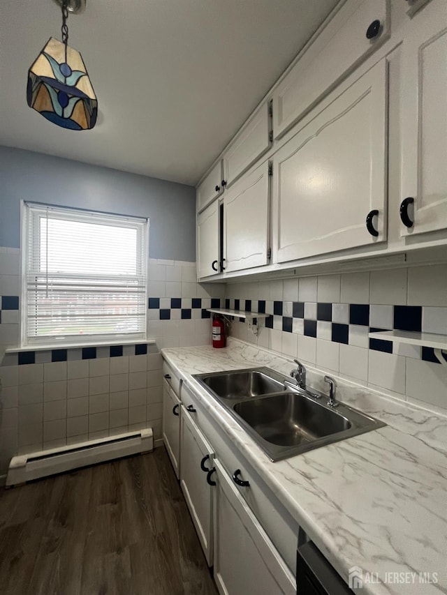 55 Gills Ln Unit 64, Iselin, NJ 08830 - kitchen featuring a baseboard heating unit, white cabinetry, light countertops, and tile walls