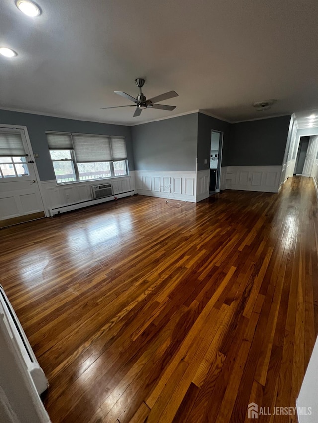 55 Gills Ln Unit 64, Iselin, NJ 08830 - empty room with a decorative wall, ceiling fan, wood-type flooring, wainscoting, and crown molding