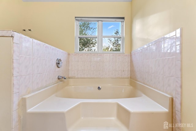 full bathroom with a bath