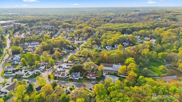 aerial view featuring a view of trees and a residential view