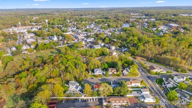 bird's eye view featuring a view of trees and a residential view