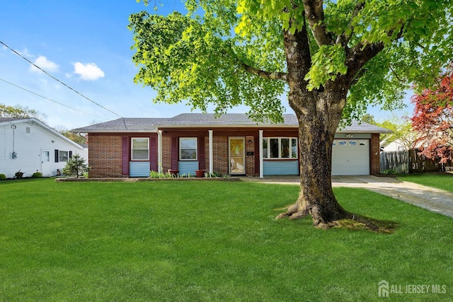 32 Drake Ave, Monroe, NJ 08831 - ranch-style house featuring brick siding, an attached garage, and concrete driveway