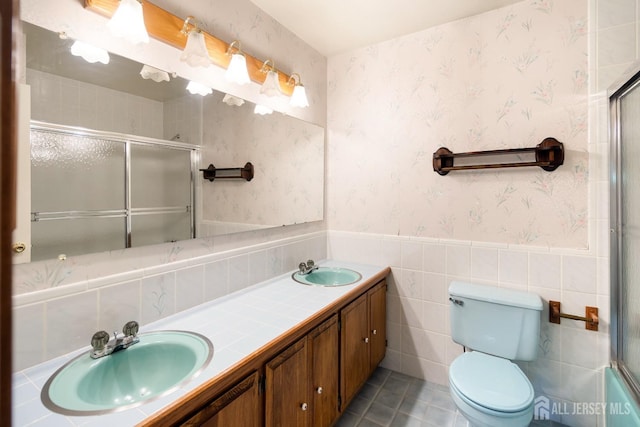 32 Drake Ave, Monroe, NJ 08831 - bathroom featuring an enclosed shower, double vanity, wainscoting, toilet, and wallpapered walls