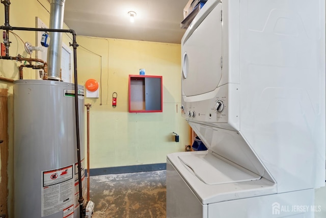 32 Drake Ave, Monroe, NJ 08831 - laundry room with stacked washer and clothes dryer, gas water heater, and baseboards