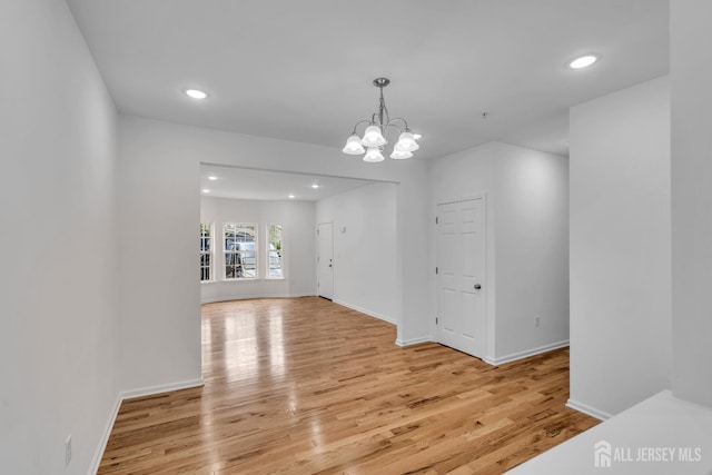 116 Forest Dr, Piscataway, NJ 08854 - unfurnished room featuring light wood-type flooring, a chandelier, recessed lighting, and a pendent fire sprinkler
