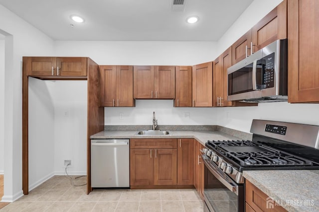 116 Forest Dr, Piscataway, NJ 08854 - kitchen featuring stainless steel appliances, brown cabinetry, recessed lighting, and light countertops