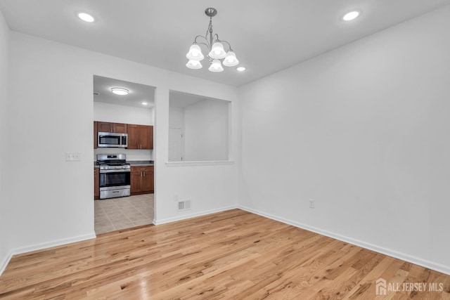 116 Forest Dr, Piscataway, NJ 08854 - unfurnished dining area with light wood-style flooring, a chandelier, and recessed lighting