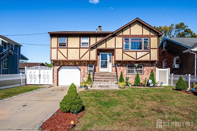 tudor-style house with a front lawn and a garage