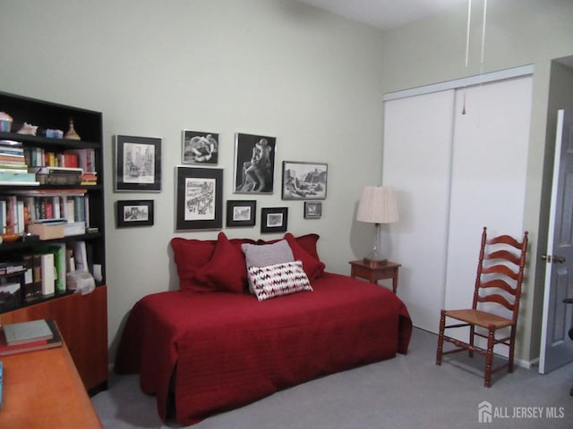 bedroom with carpet floors and a closet