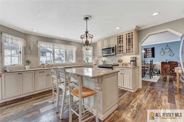 18 Jason Ct, Colonia, NJ 07067 - kitchen with stainless steel appliances, a center island, dark wood finished floors, glass insert cabinets, and recessed lighting