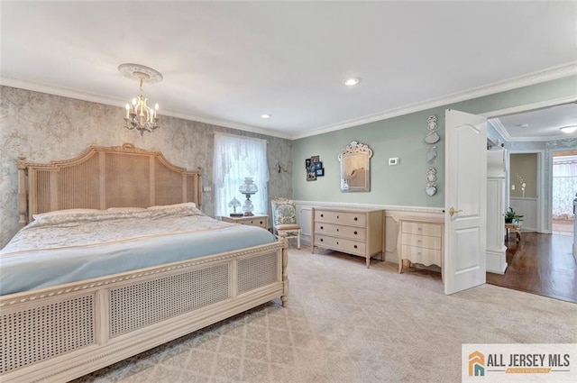 carpeted bedroom with crown molding, a chandelier, and wallpapered walls