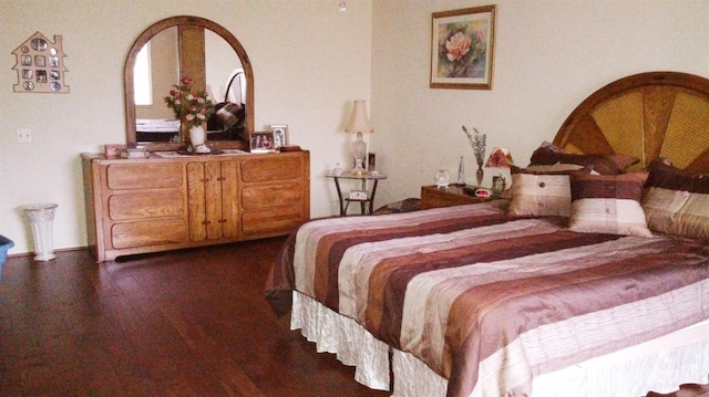 bedroom with wood finished floors