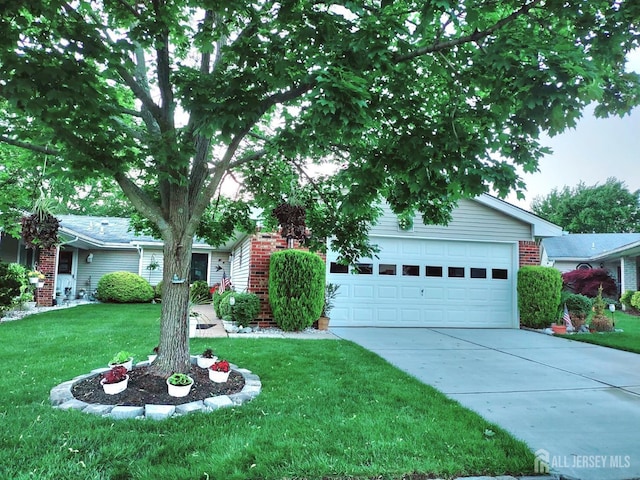 single story home featuring driveway, an attached garage, a front lawn, and brick siding