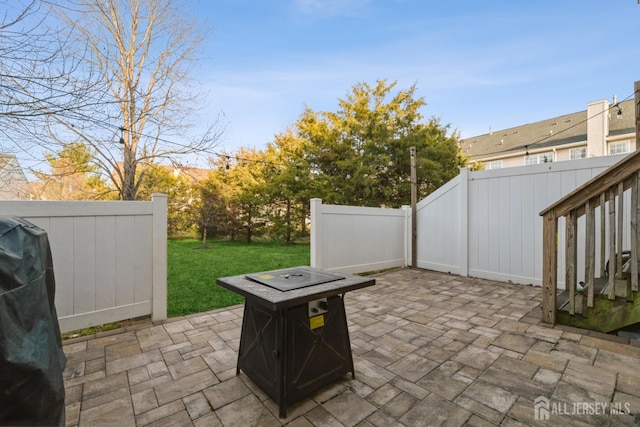1404 Yarrow Cir S, Brunswick, NJ 08810 - view of patio featuring a fire pit