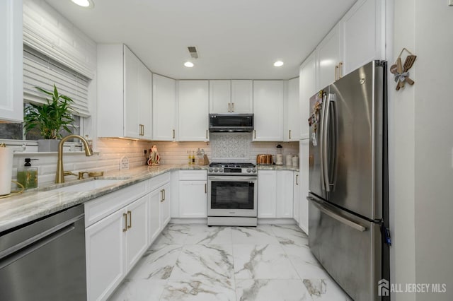 29 Chimney Ct, Old Bridge, NJ 08879 - kitchen with appliances with stainless steel finishes, a sink, light marble finish flooring, white cabinetry, and recessed lighting