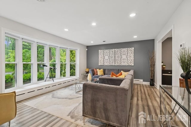 9 Valley Forge Dr, East Brunswick, NJ 08816 - living room featuring baseboard heating, wood finished floors, a baseboard radiator, and recessed lighting