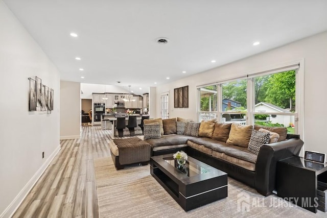 9 Valley Forge Dr, East Brunswick, NJ 08816 - living room with light wood-style floors and recessed lighting