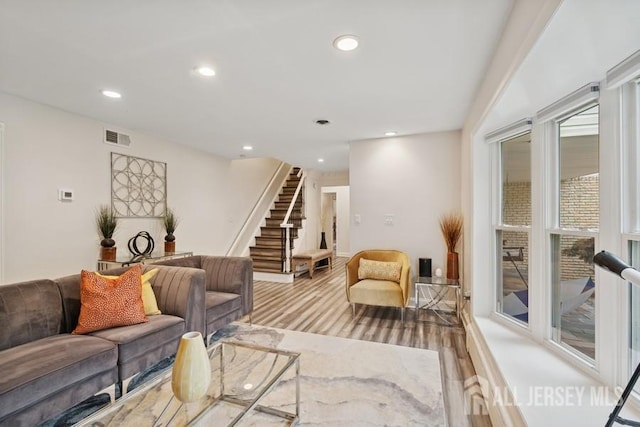 9 Valley Forge Dr, East Brunswick, NJ 08816 - living area with light wood-type flooring, stairway, and recessed lighting