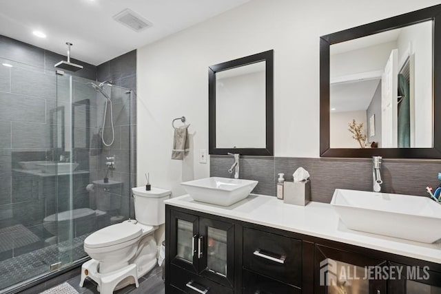 9 Valley Forge Dr, East Brunswick, NJ 08816 - bathroom with a shower stall, double vanity, recessed lighting, and decorative backsplash