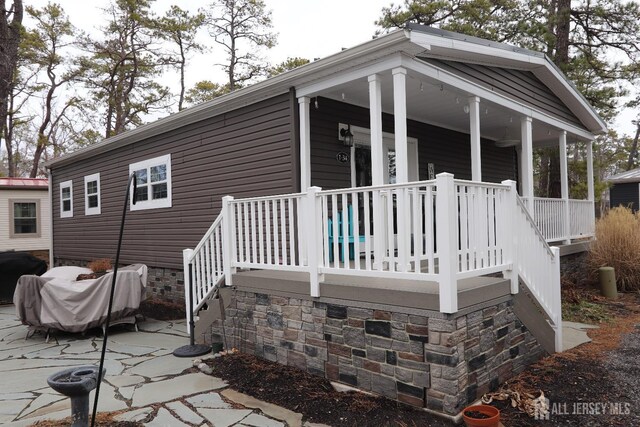 106 E Moss Mill Rd E Unit T-34, Galloway, NJ 08205 - view of property exterior featuring covered porch