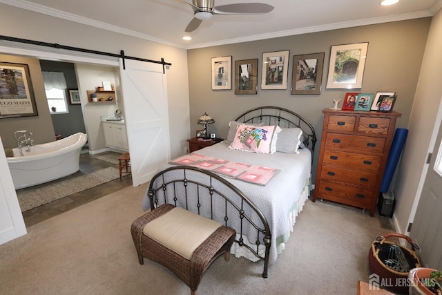 bedroom with recessed lighting, light colored carpet, a barn door, and ornamental molding